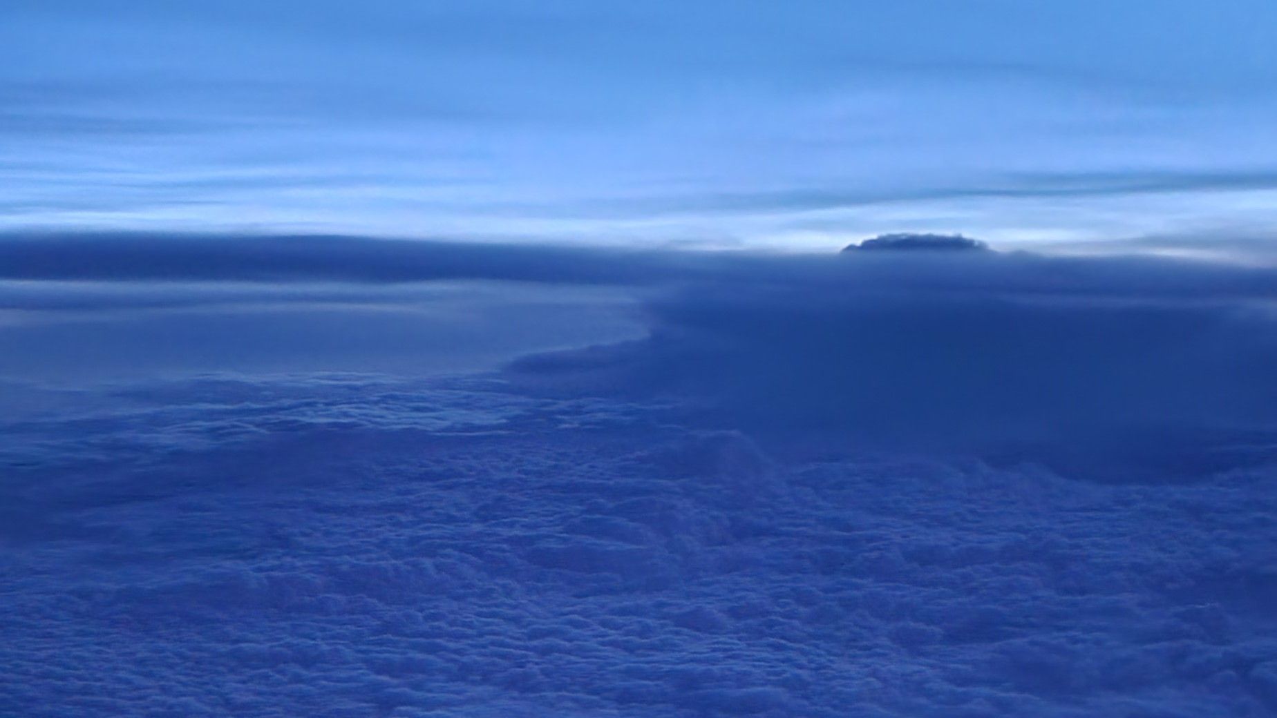 A field of blue clouds in the sky at early morning.